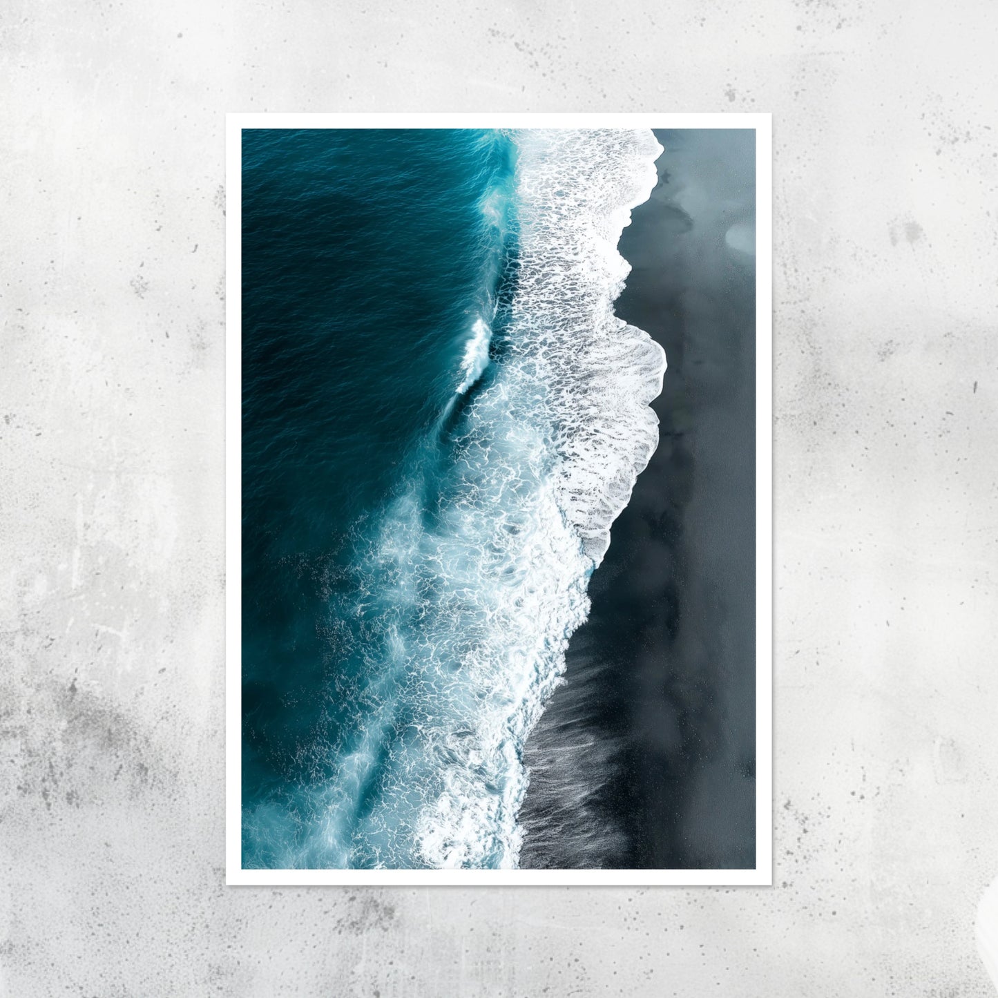 Unframed A2 seascape print with black sand and shoreline waves.
