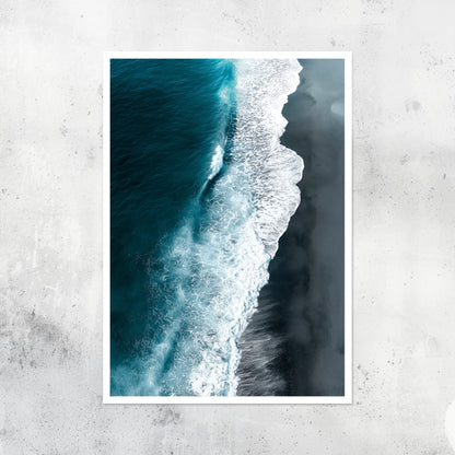Unframed A2 seascape print with black sand and shoreline waves.
